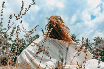 Wall Mural - beautiful young boho woman having fun outdoors