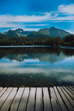 Fototapeta Przestrzenne - wooden pier on lake with mountains