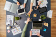 © Syda Productions - business, people and team work concept - team of startuppers with gadgets and papers working at office table