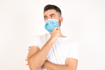 Sticker - Face expressions and emotions. Thoughtful young man in casual clothes holding hand under his head, having doubtful look.