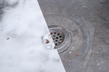 Wall Mural - Photo of the kitchen sink before and after applying the foamy detergent