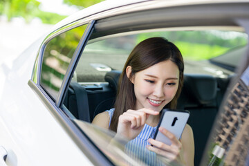 Wall Mural - businesswoman use phone in car