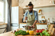 © Svitlana - Young man, chef cook using hand blender while preparing Italian meal in the kitchen
