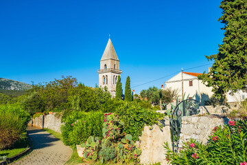 Beautiful ancient town of Osor on the island of Cres in Croatia, gardens and cathedral tower