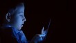 © MEDIAIMAG - Late night kid on touchscreen during home lockdown