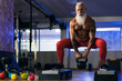 © Alessandro Biascioli - Senior fitness man doing kettle bell exercises inside gym - Fit mature male training in wellness club center - Body building and sport healthy lifestyle concept