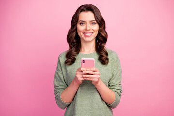 Wall Mural - portrait of positive cheerful girl blogger use cellphone enjoy searching social media news wear good