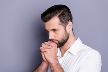 Wall Mural - Profile side photo of minded pensive guy wait job vacancy decisions touch fist together chin look copyspace wear white trendy shirt isolated over gray color background