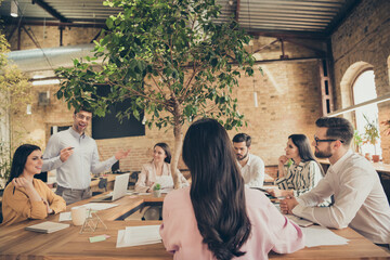 Poster - Photo of business men ladies people partners sitting around table spacious office seven members successful guy telling new plans professionals good mood discussing project indoors