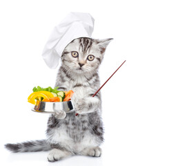 Poster - Cute kitten wearing chef's hat stands with bowl of the vegetables and shows away on empty space. Isolated on white background