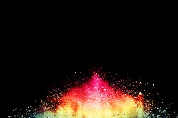 Wall Mural - explosion of colored powder isolated on black background.