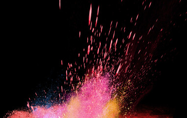 Wall Mural - explosion of colored powder isolated on black background.