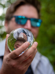 person holding a glass of water