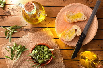 Sticker - Slices of bread with oil on wooden table in countryside