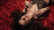 © stockbusters - Sexy girl pleasuring herself on red silk sheets. Closed eyes woman stroking body