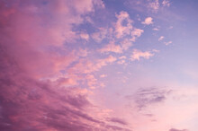 Beautiful Pink Sky Background. Soft Clouds At Sunset. Many Blue, Magenta And Orange Tones And Patterns Of Clouds
