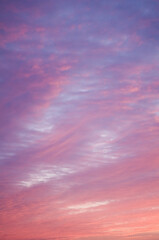 beautiful pink sky background. soft clouds at sunset. many blue, magenta and orange tones and patter