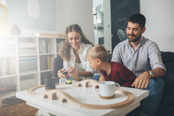 cute young family spending time together at home