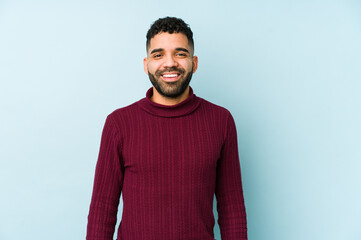 Wall Mural - Young mixed race arabic man isolated happy, smiling and cheerful.