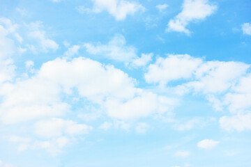light pastel blue sky with white clouds