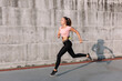© Viktor Solomin/Stocksy - Summer sport street style portrait of young beautiful runner athlete woman