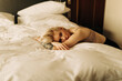 © Alexey Klementiev/Stocksy - portrait of real beautiful young woman on the bed