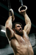 © Viktor Solomin/Stocksy - Handsome athlete gym training