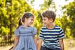 © Clare Seibel-Barnes/Austockphoto - Brother and sister laughing together outdoors
