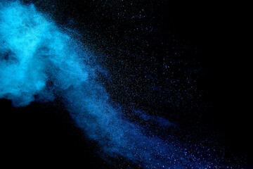 Wall Mural - Closeup of blue dust particle splash isolated on black background.