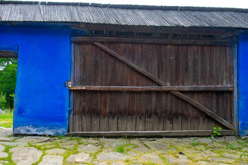 Wall Mural - wooden door and window of the traditional wooden and brick house in the authentic village