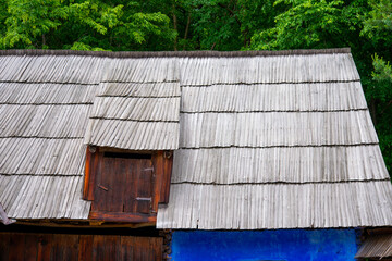 Wall Mural - peasant house with thatched roof and tile built of clay and brick