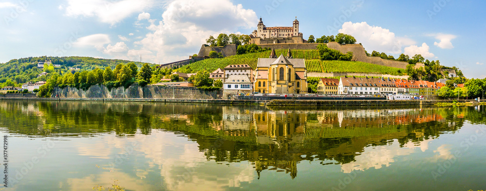 Panoramic view at the Bank of Main river with Marienberg Castle and At.Bukard church in Wurzburg ,Germany - obrazy, fototapety, plakaty 