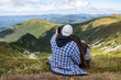 © Liubov Kartashova - young couple travels and is photographed on a background of mountains
