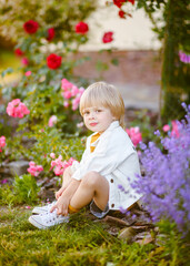 portrait of little model boy in nature