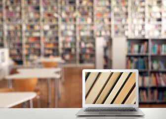 Wall Mural - Digital library concept. Modern laptop on table indoors, space for text