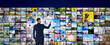 © New Africa - Media library concept. Man using virtual video gallery, banner design
