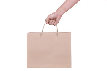 Wall Mural - Hand Holding Paper Bag isolated on White Background. COPY SPACE.