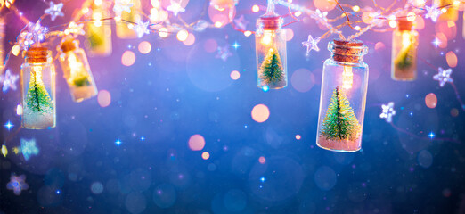Wall Mural - abstract christmas card with defocused vintage effects - string light with trees in glass jars decor