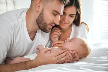 Sticker - Happy couple with their newborn baby at home