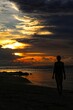 © Mike Uteshev - silhouette of a person on the beach at sunset