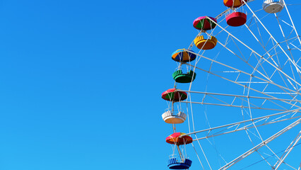 summer attraction in the amusement park ferris wheel against