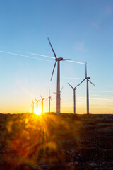 wind turbines at dusk. landscape sunset with windmills. renewal source of electricity. wind turbines