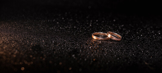 Wedding rings in raindrops