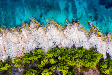 Fototapeta Croatia. Coast with rocks as a background from top view. Blue water background from top view. Summer seascape from air. Travel - image