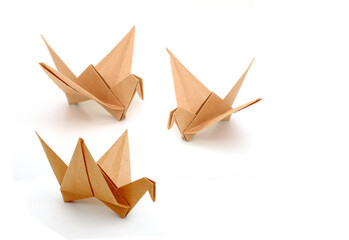 Two origami recycled paper birds