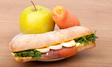 Real Sandwich With Smoked Salmon, Eggs And Green With Apple And Carrot On A Wooden Background.