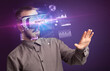 © ra2 studio - Businessman looking through Virtual Reality glasses with BENEFITS inscription, new business concept