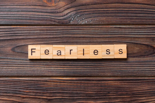 Fearless word written on wood block. Fearless text on cement table for your desing, concept