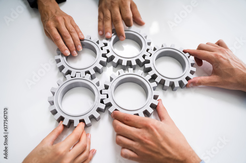 Cuadros en Lienzo Innovative Businesspeople Team Hands Joining Gears