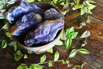 Wall Mural - A top view image of rough Canadian amethyst in a hand made pottery bowl. 